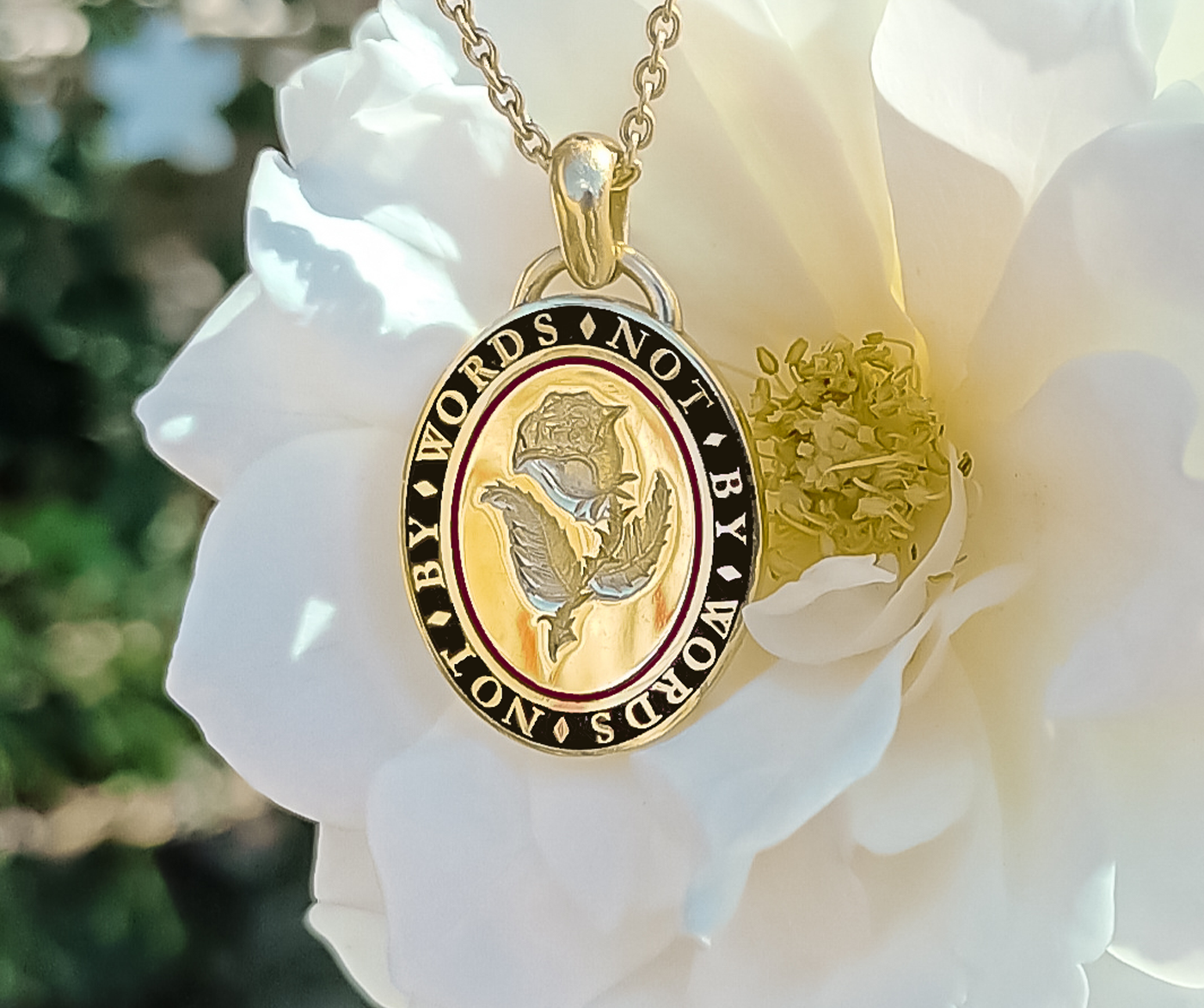 Bespoke Rebus hand engraved memento mori pendant necklace in 18ct yellow gold with black and red enamel