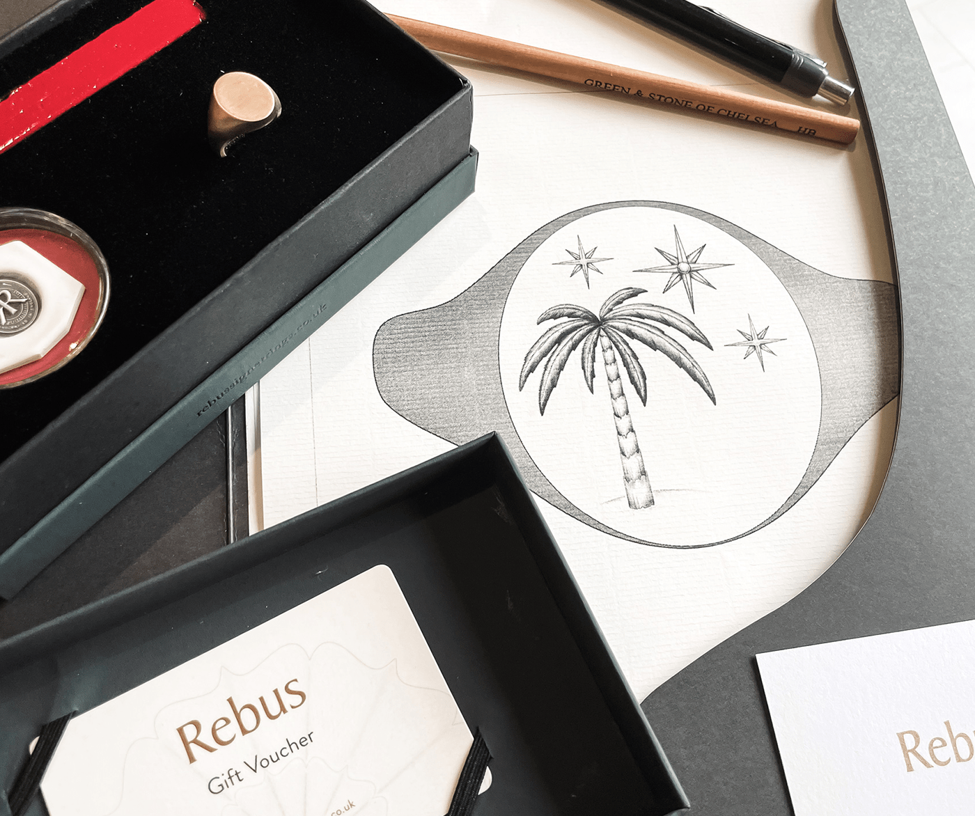 Rebus bespoke signet ring gift box with bronze replica ring, wax seal, and personalised illustration for hand engraving